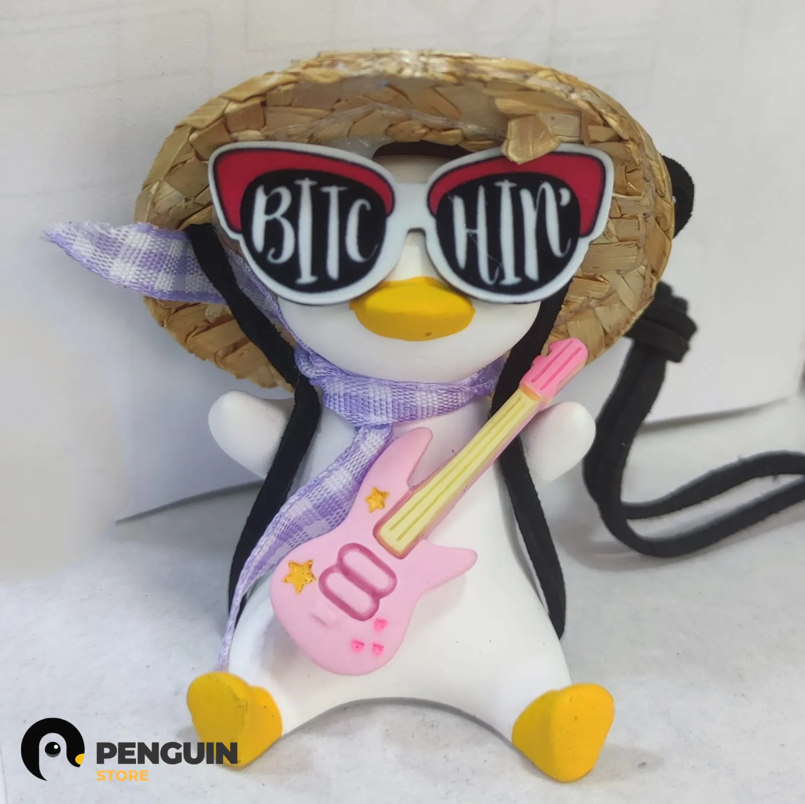 دلاية "البطة الروك ستار" (Rockstar Duck) للسيارة - إكسسوار مرآة السيارة بتصميم جيتار ونضارة "Bitchin" من Penguin Store 🎸🕶️✨