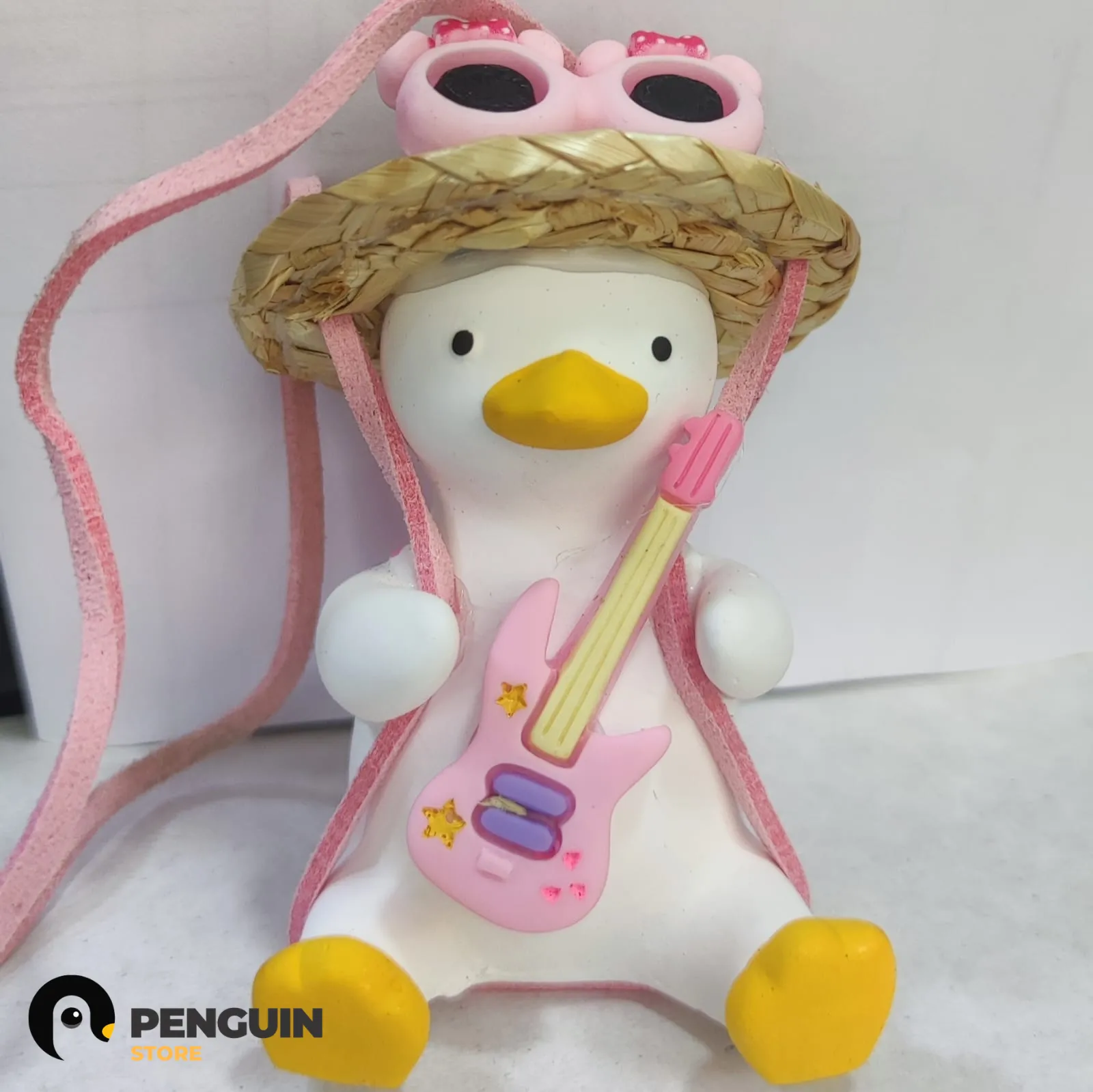 دلاية "البطة الروك ستار" (Rockstar Duck) للسيارة - إكسسوار مرآة بتصميم جيتار ونضارة "Bitchin" من Penguin Store 🎸🕶️✨